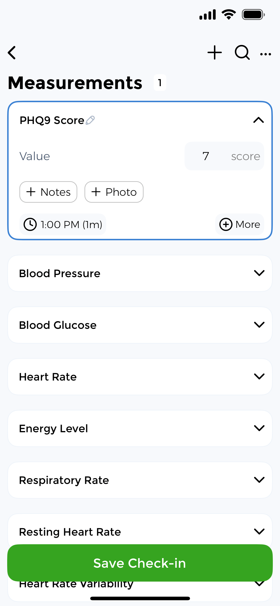PHQ9 score check-in screen with options to add notes and photos